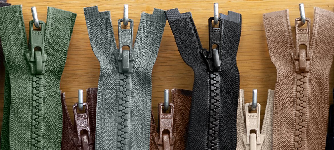 #5 Molded Plastic Jacket Zippers Organized Hanging On Hooks