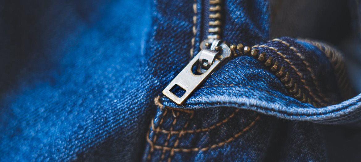 Brass Jean Zipper Unzipping Pair of Blue Jean Pants