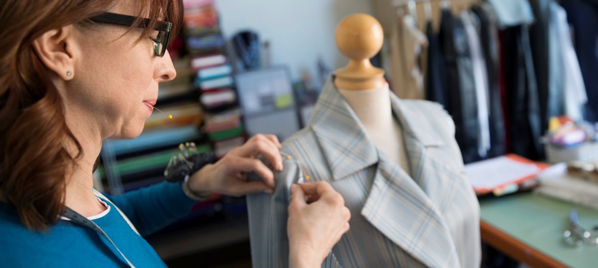 Seamstress Pinning Fabric with Yellow Ball Head Pins